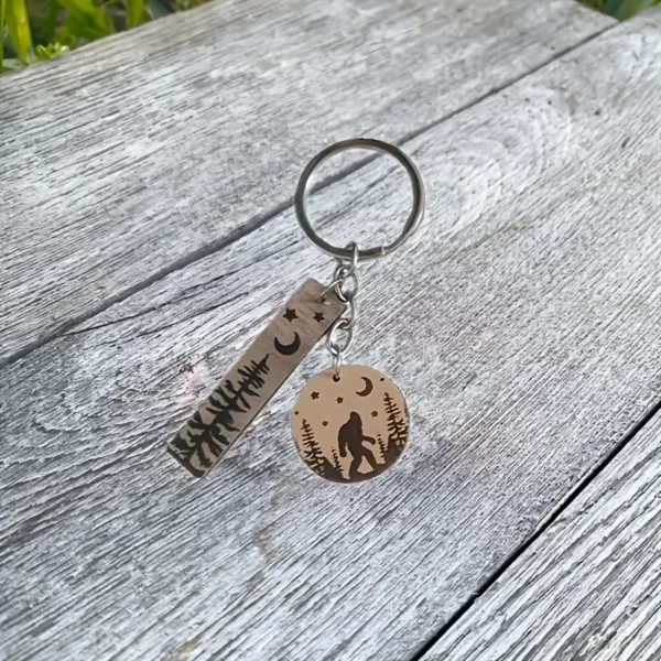 1pc Bigfoot and Forest Wooden Keychain - Iron Casual Style Keyring with Pine Tree, Stars, and Moon Charms - Halloween, Thanksgiving, Christmas Gift for Men